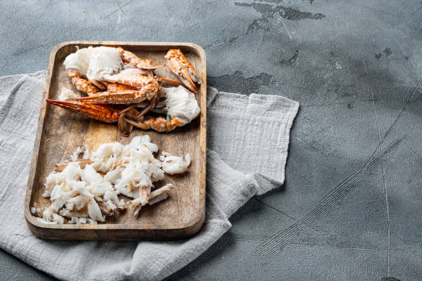 istock Cooked crab claws and legs meat, on gray background  , with copyspace  and space for text 1300999577