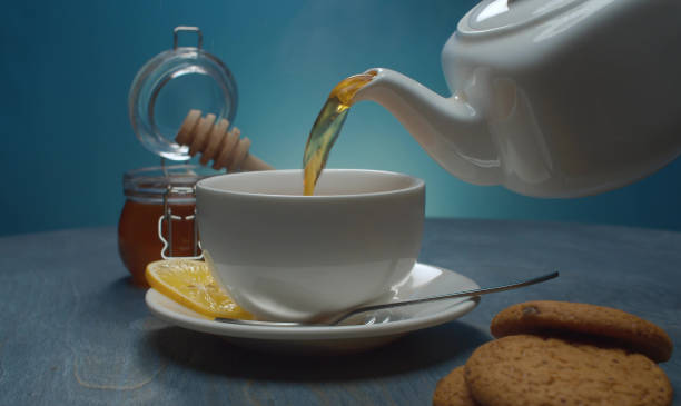 istock Hot tea pouring into the cup 1301000518