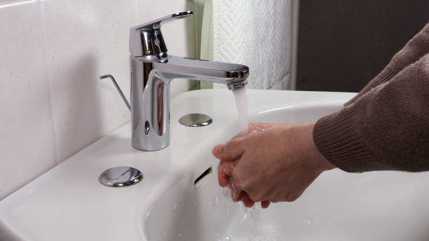 istock Unrecognisable person washing hands 1301000814