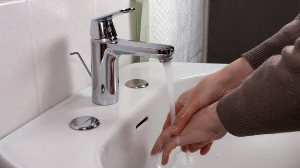 istock Unrecognisable person washing hands 1301000855