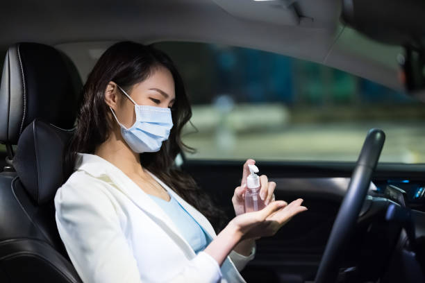 istock businesswoman use hand sanitizer 1301001942