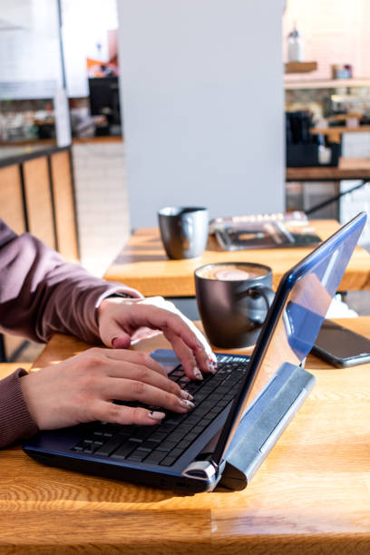 istock Young woman in a comfortable tracksuit works on the computer. 1301002164