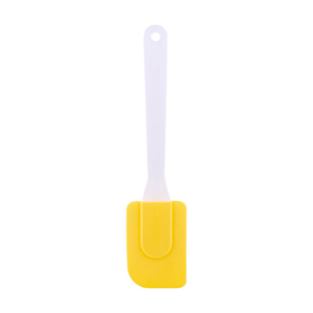 Yellow silicone spatula isolated on white background, copy space stock photo