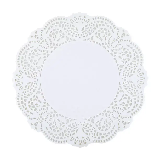 Photo of Round white doily isolated on white background, copy space. Clipping path