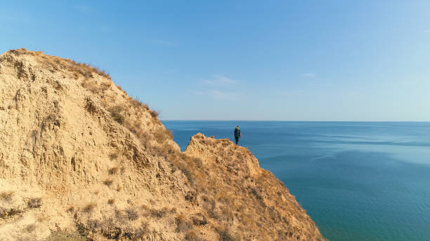 istock The hiker standing on a mountain on the beautiful sea background 1301006403