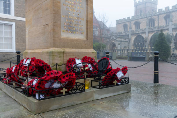 red poppies with rosemary and lest we forget words on Anzac day