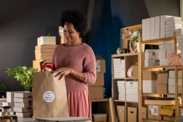 istock Making a care package for customers that support her small business 1301007618