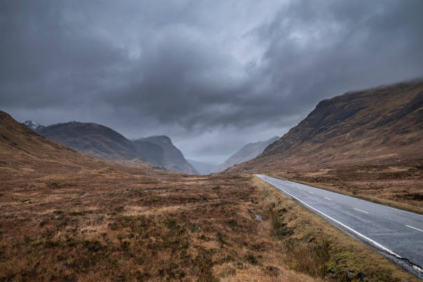 istock Majestic landscape image view down Glencoe Valley in Scottish Highlands with mountain ranges in dramatic Winter lighting 1301009245