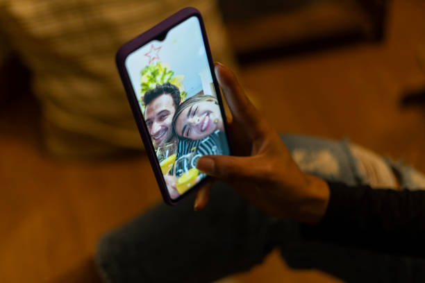 istock Couple enjoy watching their Christmas tree 1301009518