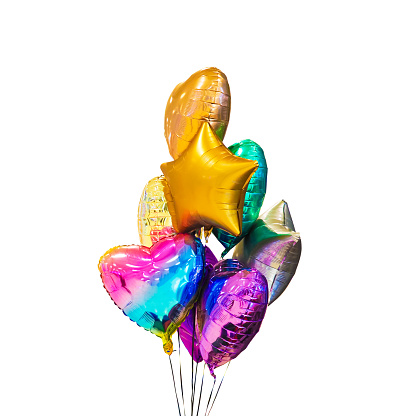 Multicolored bright festive balloons in the form of a heart and a star filled with helium. Balloons isolated on white background, gift and birthday decoration