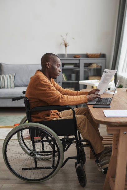 istock Handicapped African American Man Working from Home 1301014441