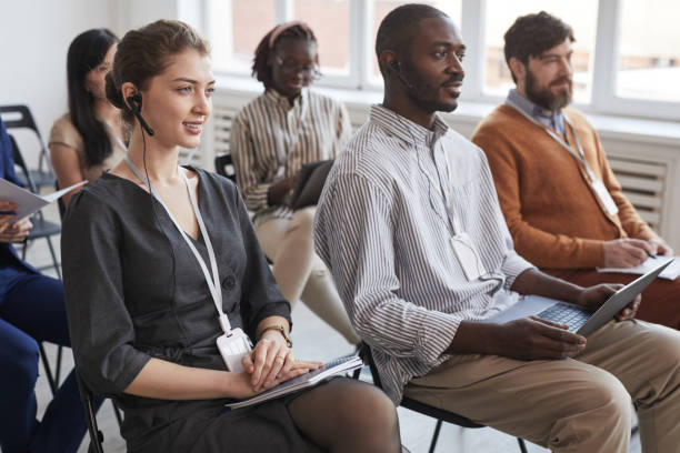 istock Group of Business People in Audience 1301017463