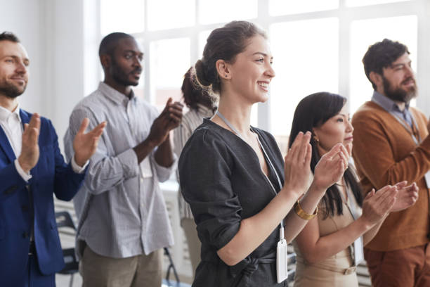 istock Business People Applauding Standing Up 1301017467