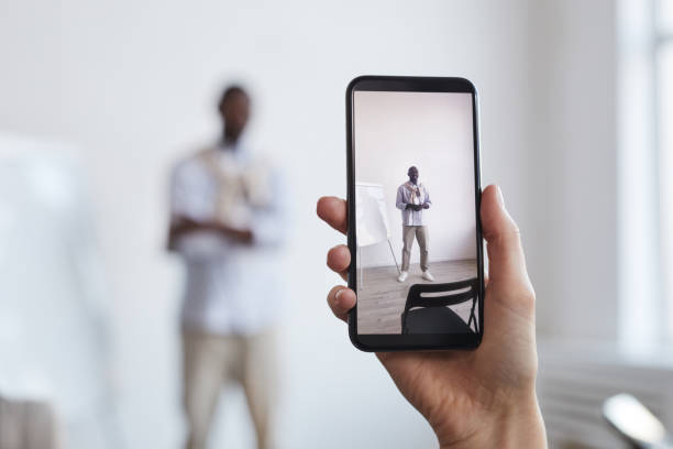 istock Hand Holding Smartphone and Taking Photo 1301017489