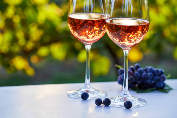 istock Two glasses with rose wine on the table 1301017795