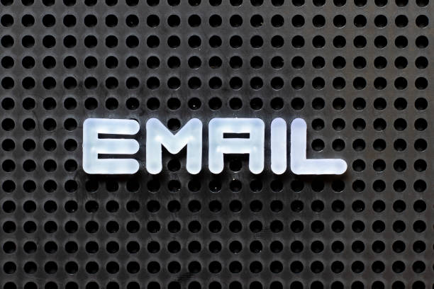 istock White color alphabet with word e mail on black pegboard background 1301019208