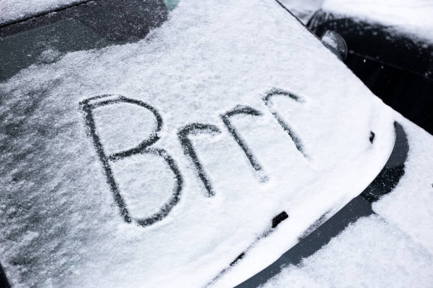 istock Freezing cold car in blizzard with brrr written in the snow 1301019780