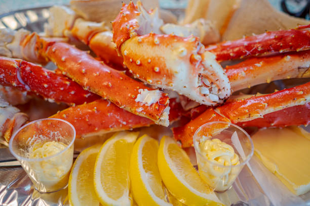 istock Red king crab legs with fresh lemon slices 1301020622