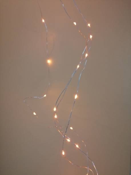 istock Christmas lights isolated on a plain light background. Christmas glowing garlands 1301021195