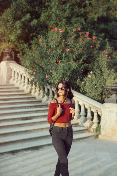 istock Woman with a Backpack on the City Park 1301021781