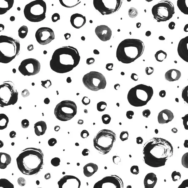 Vector illustration of Seamless surface pattern design in vector with uneven messy irregular painted little and big circles isolated on white paper card - little rings painted by hand and black paint - abstract background with 3D effect - unique textile with texture effect