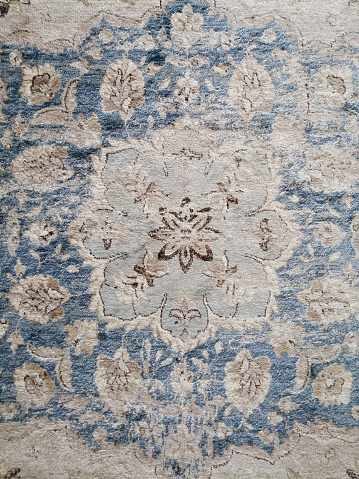 shabby carpet top view. the effect of an aged carpet. vintage texture for interior decor