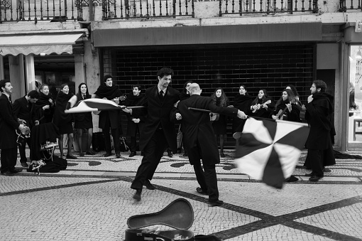 Lisbon, Portugal - Mars 22, 2014: A traditional group of college students perform in the Rua Augusta street in Lisbon downtown.