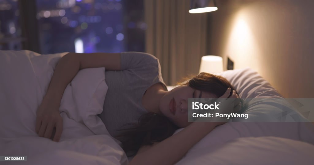 Asian woman lose sleep Asian woman lose sleep on the bed at night Insomnia Stock Photo
