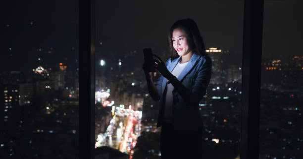 istock woman use smartphone near window 1301028698