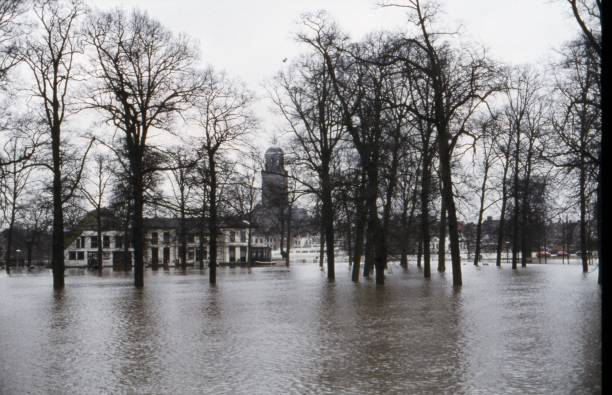 Deventer, The Netherlands, January 10, 1980High tide of the river IJssel. The floodplains are under water. The IJsselhotel is in the foreground between the trees in the water, flooded. In the background the Lebuïnus church. Photo taken from the west bank towards the city centre of Deventer.