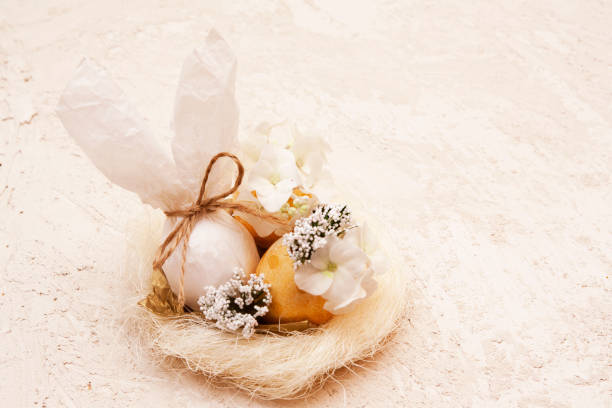 istock Easter composition: abstract rabbit and eggs with flowers in a nest 1301031402