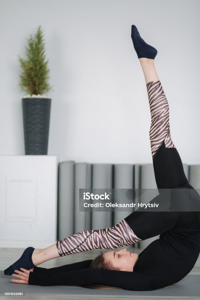 Young Stretching Master Show Differnt Poses For Stretch Stock Photo