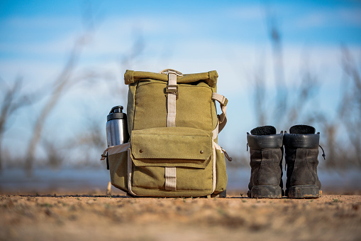 Photography hiking backpack and boots in outback Australia