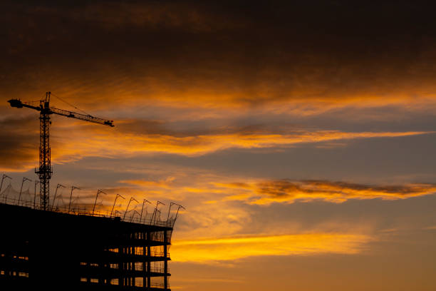 istock Backlight of a building and a crane at sunset 1301035763