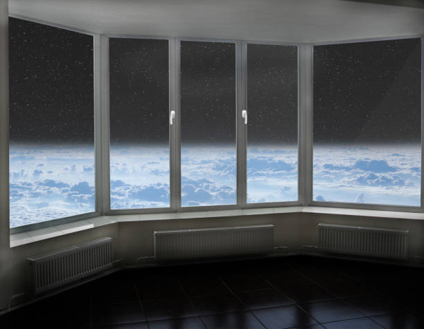 istock Room window with view to space above Earth's atmosphere and cosmos 1301038712