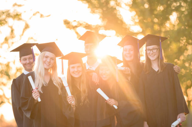istock Group of happy high school graduates 1301038773