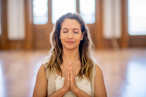 istock Meditating before the start of yoga class 1301039873