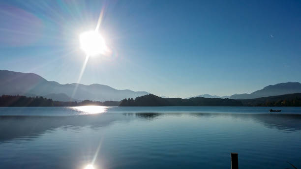istock Faakersee - A panoramic view on the Faaker lake in Austrian Alps. The lake is surrounded by high mountains. Calm surface 1301039980