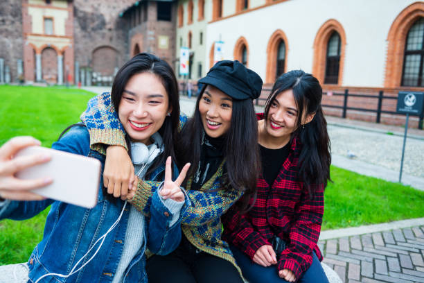 istock Smiling young women have fun on vacation 1301040317