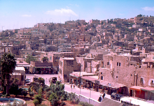 Black and white photo with the view of Midyat city with historical houses, mosque and Assyrian church