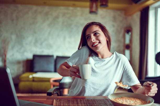 istock Female Taking Phone Call During Breakfast Time 1301040370