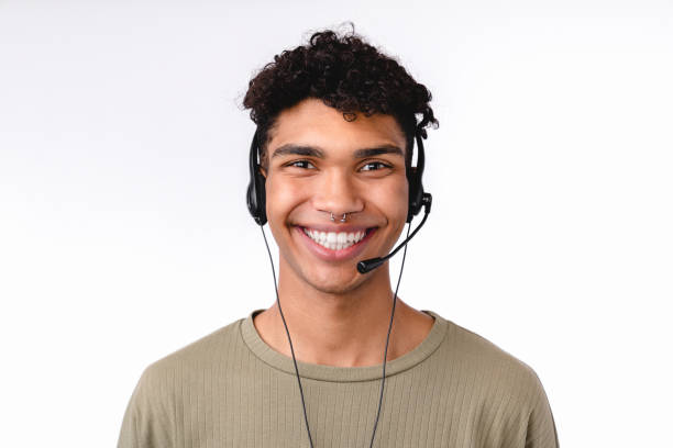 istock Cheerful young man in dispatcher`s headset isolated over white background 1301040438