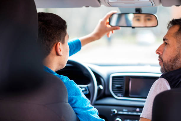 istock Teenage boy having driving lesson with male instructor 1301040547
