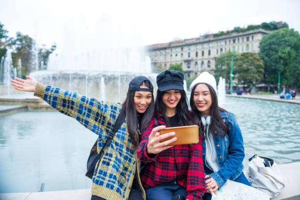 istock Smiling young women have fun on vacation 1301040589