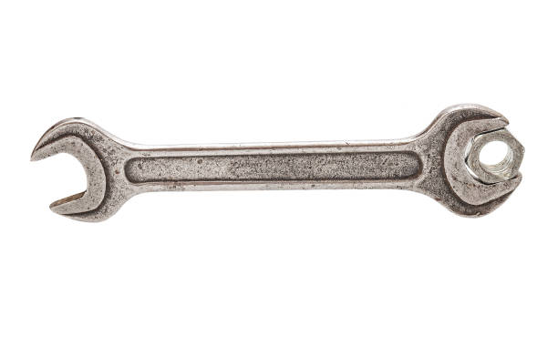 istock Old metal wrench close up isolated on white background 1301040640
