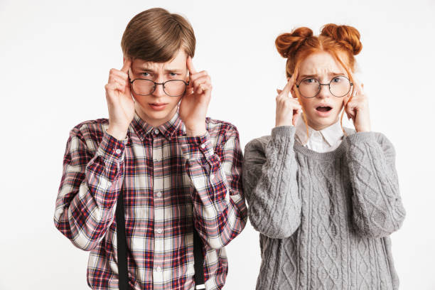 istock Upset couple of school nerds having headache 1301041323