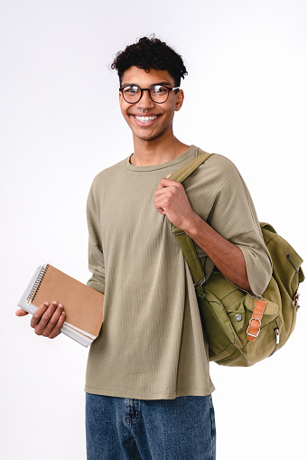Vertical shot of a mixed-race student isolated over white background
