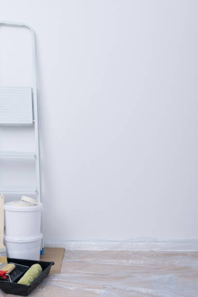 istock background for lettering, white wall, stairs and tools 1301042092