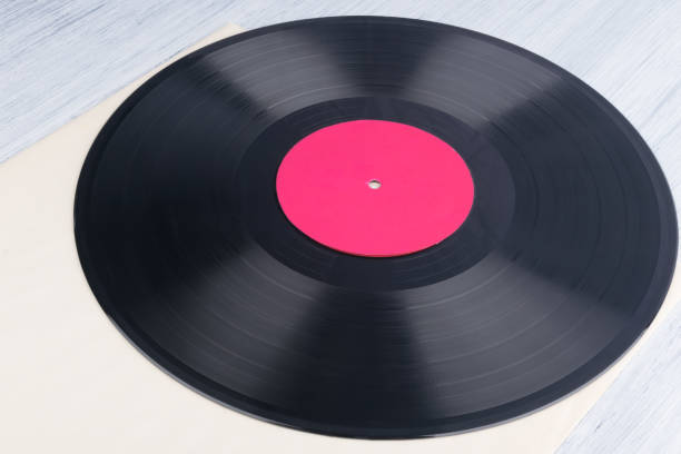 istock on a light gray background, on a paper envelope, is a vinyl record, background 1301042294