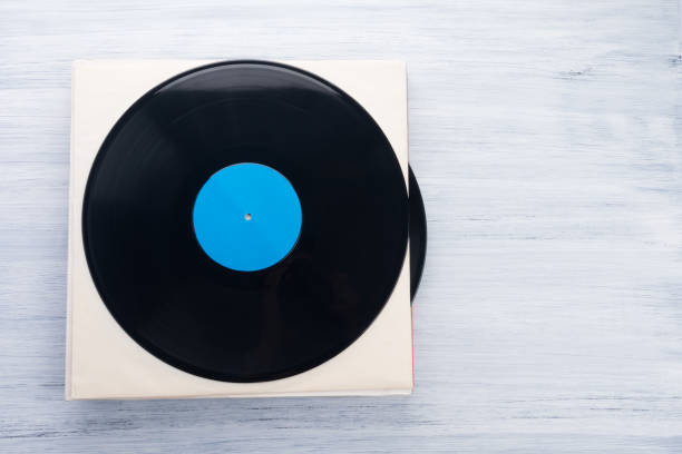 istock n a light gray background, on a paper envelope, there are vinyl records, there is a place for the inscription 1301042332
